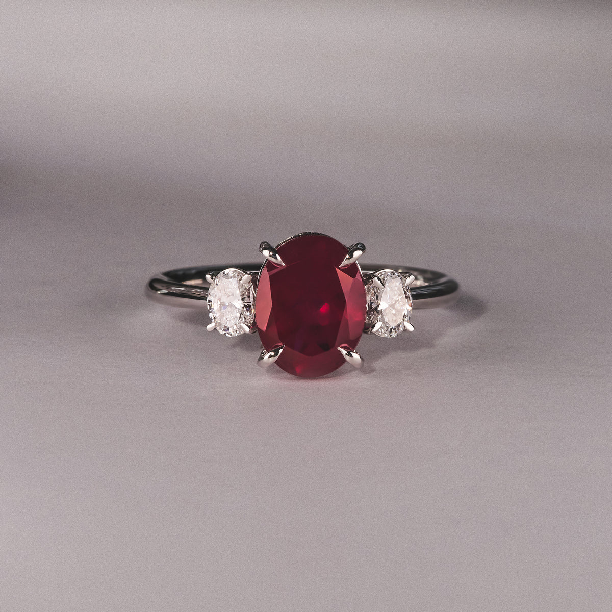 Solene 2.00ct Oval Cut Lab Ruby and Lab Diamond 3 Stone Engagement Ring in 18K White Gold