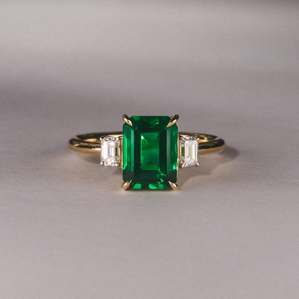 Solene 2.50ct Emerald Cut Lab Emerald and Lab Diamond 3 Stone Engagement Ring in 18K Yellow Gold