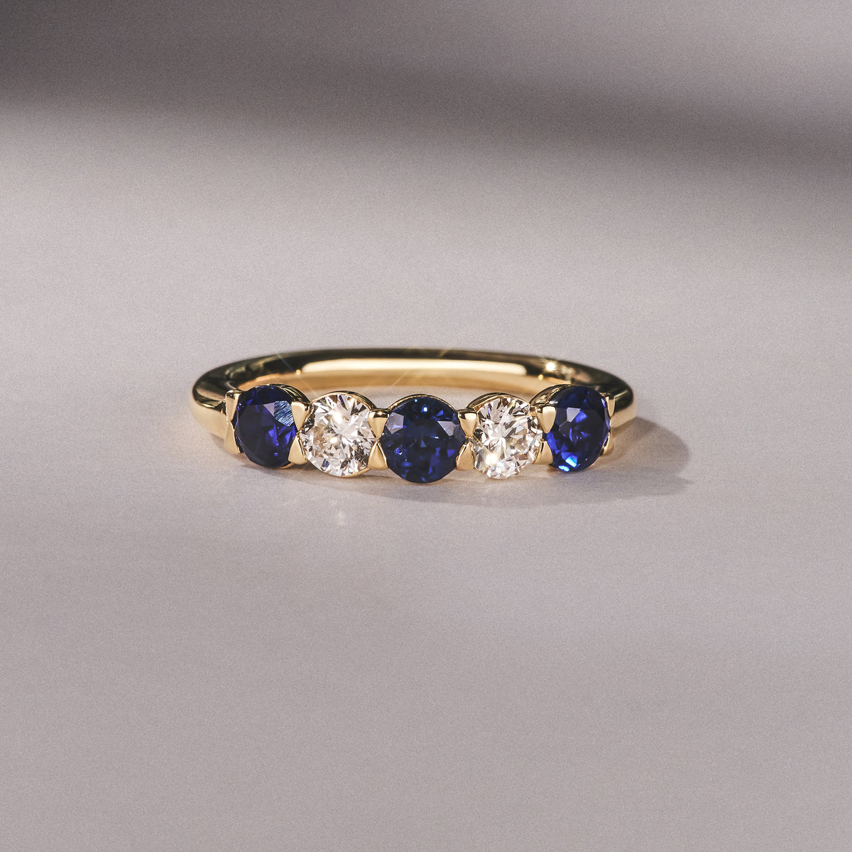 Solene 0.75ct Round Cut Lab Sapphire and Lab Diamond Half Eternity Ring in 18K Yellow Gold