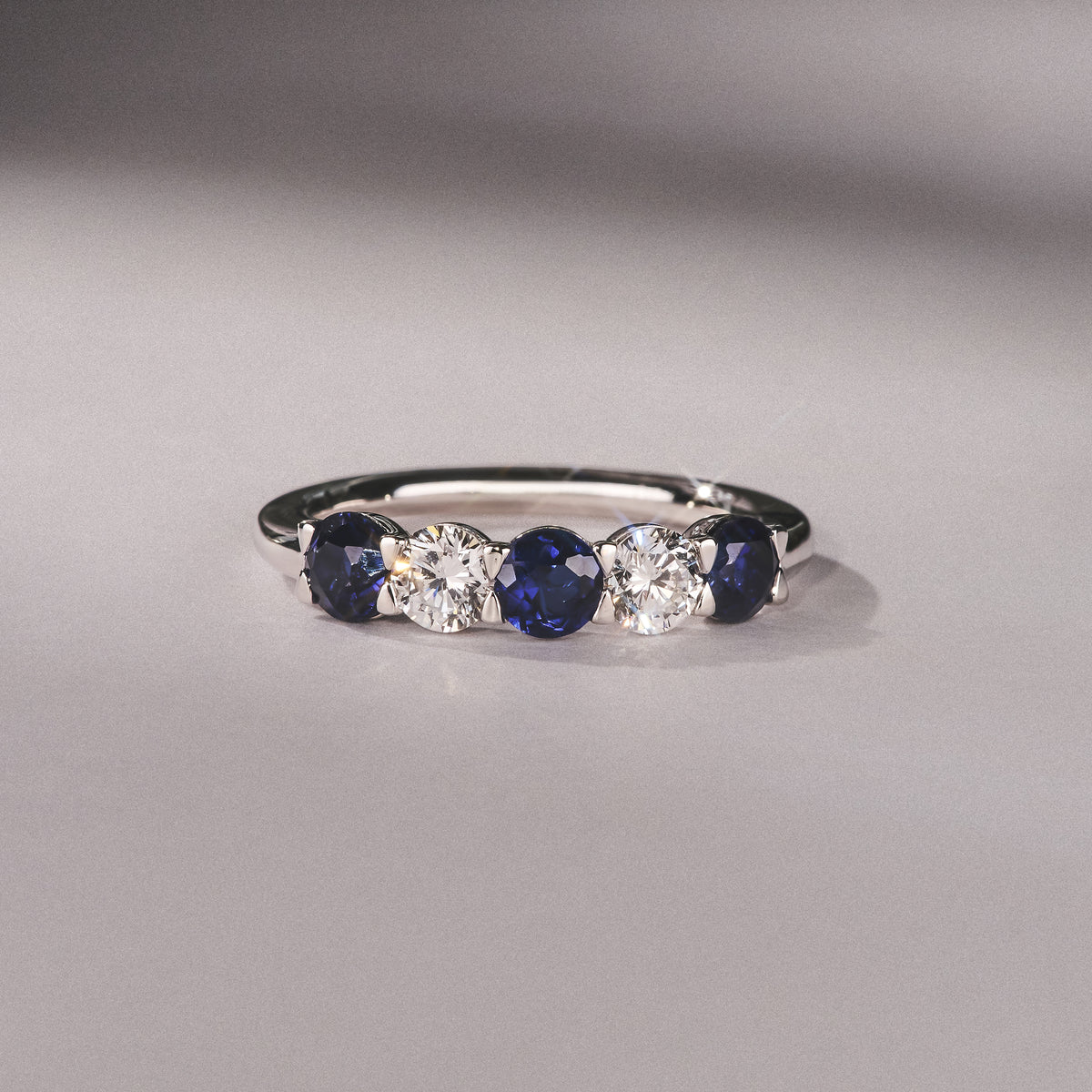Solene 0.75ct Round Cut Lab Sapphire and Lab Diamond Half Eternity Ring in 18K White Gold
