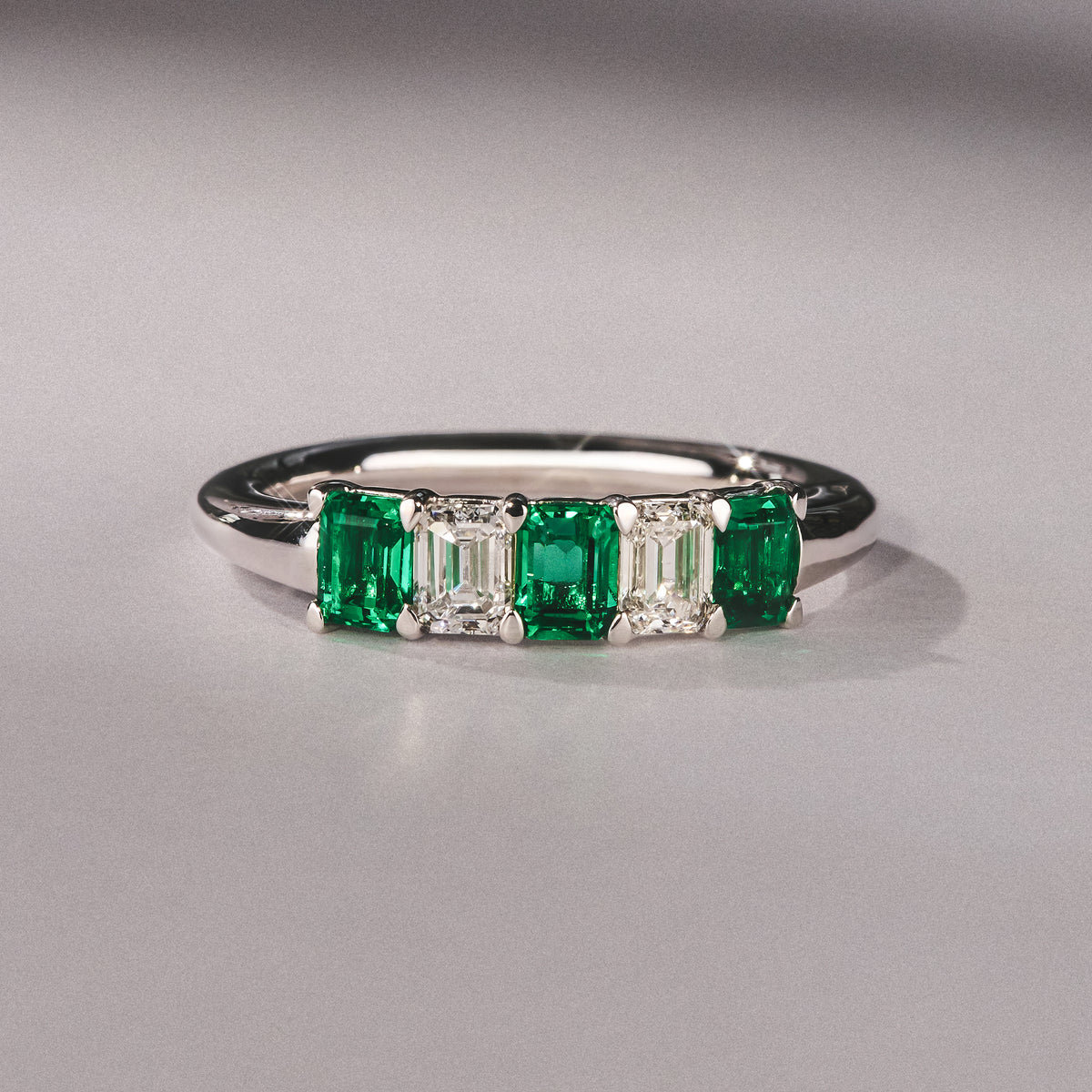 Solene 0.75ct Emerald Cut Lab Emerald and  Lab Diamond Half Eternity Ring in 18K White Gold