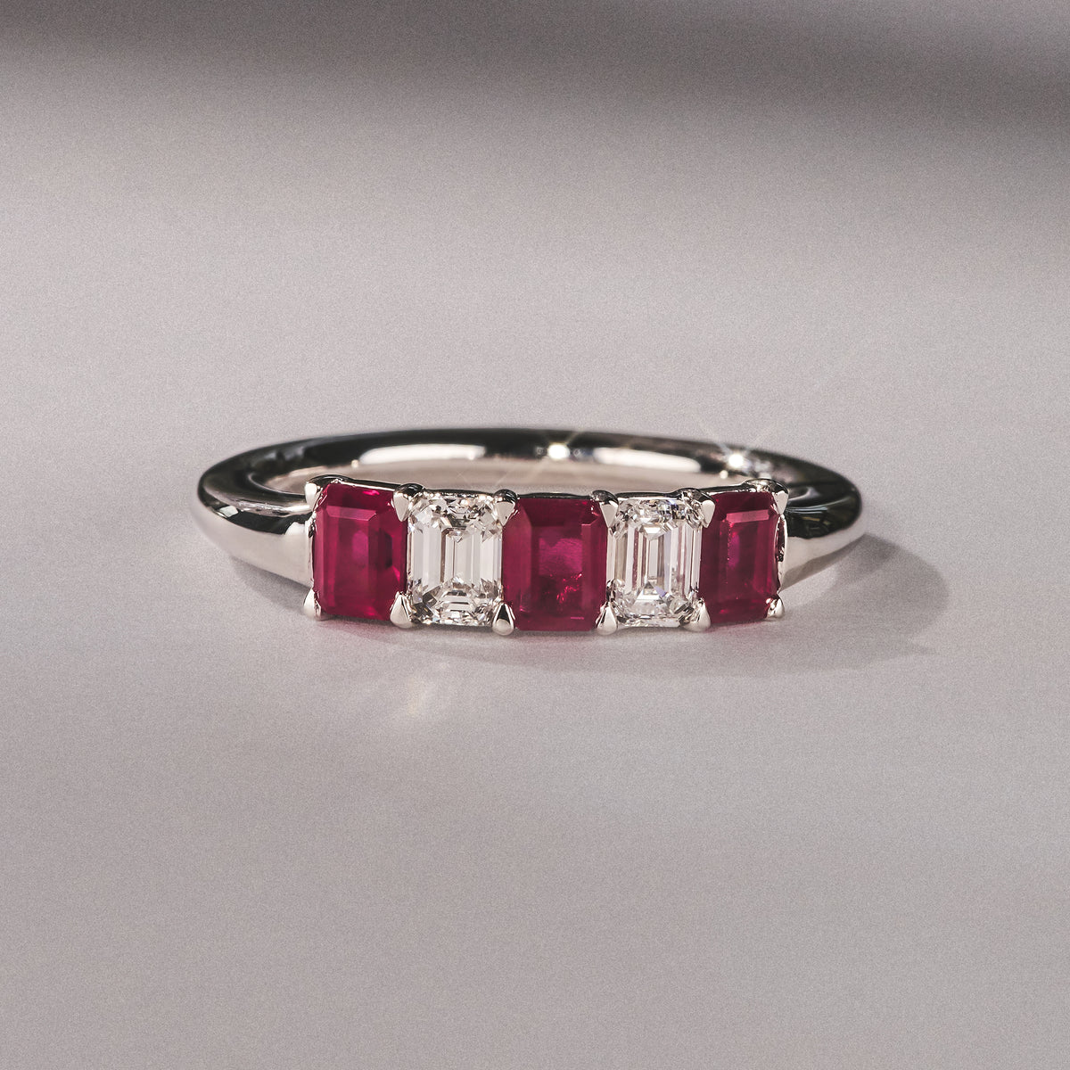 Solene 0.75ct Emerald Cut Lab Ruby and Lab Diamond Half Band Eternity Ring in 18K White Gold