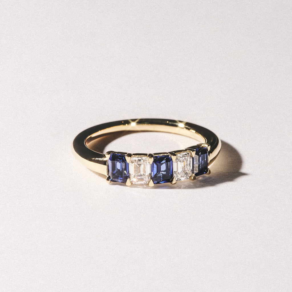 Solene 0.75ct Emerald Cut Lab Sapphire and Lab Diamond Half Band Eternity Ring in 18K Yellow Gold