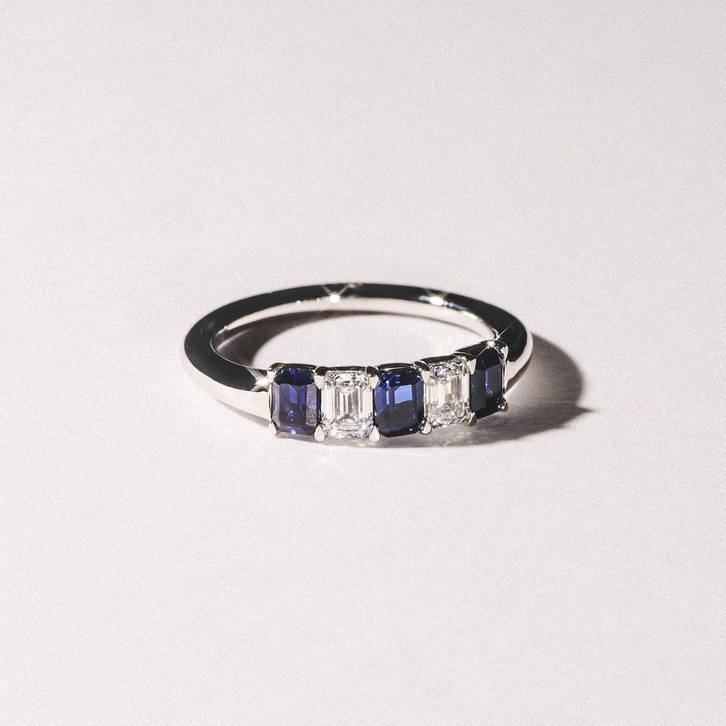 Solene 0.75ct Emerald Cut Lab Sapphire and Lab Diamond Half Band Eternity Ring in 18K White Gold