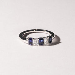 Solene 0.75ct Emerald Cut Lab Sapphire and Lab Diamond Half Band Eternity Ring in 18K White Gold
