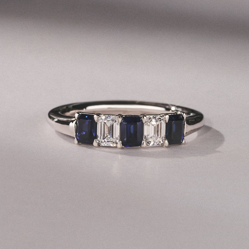 Solene 0.75ct Emerald Cut Lab Sapphire and Lab Diamond Half Band Eternity Ring in 18K White Gold
