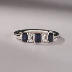 Solene 0.75ct Emerald Cut Lab Sapphire and Lab Diamond Half Band Eternity Ring in 18K White Gold