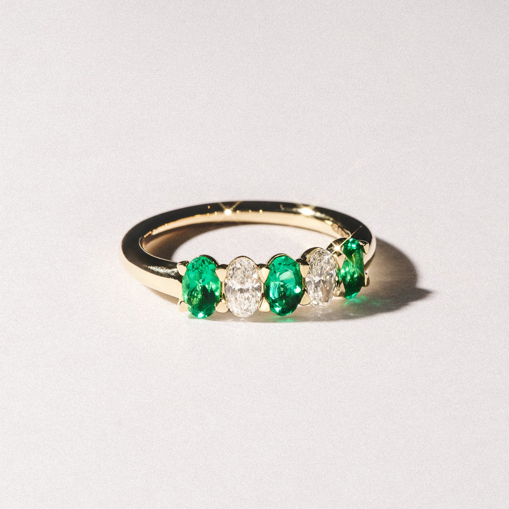 Solene 0.75ct Oval Cut Lab Emerald and Lab Diamond Half Band Eternity Ring in 18K Yellow Gold