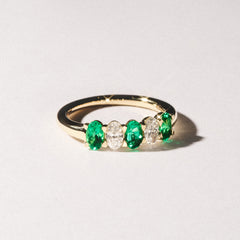 Solene 0.75ct Oval Cut Lab Emerald and Lab Diamond Half Band Eternity Ring in 18K Yellow Gold