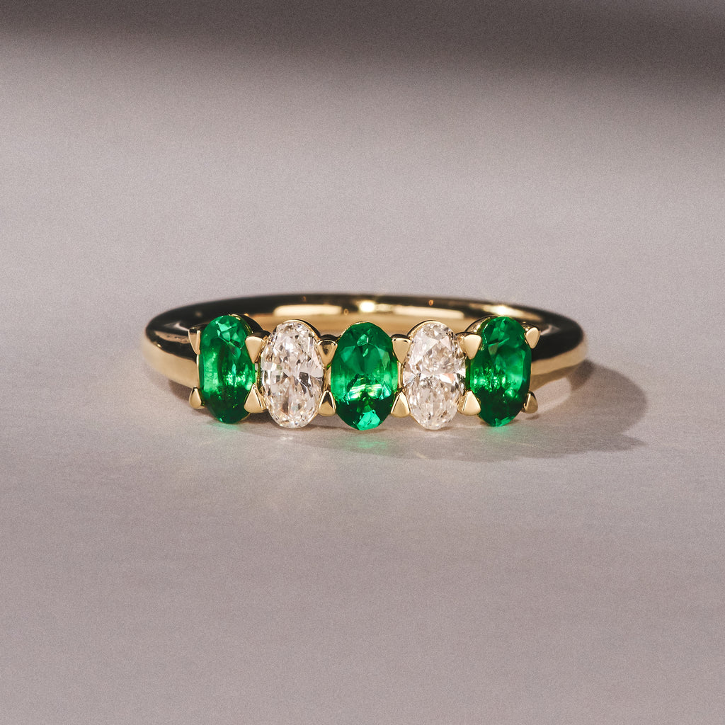 Solene 0.75ct Oval Cut Lab Emerald and Lab Diamond Half Band Eternity Ring in 18K Yellow Gold
