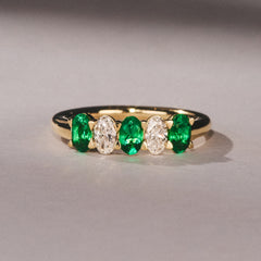 Solene 0.75ct Oval Cut Lab Emerald and Lab Diamond Half Band Eternity Ring in 18K Yellow Gold