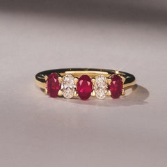 Solene 0.75ct Oval Cut Lab Ruby and Lab Diamond Half Band Eternity Ring in 18K Yellow Gold