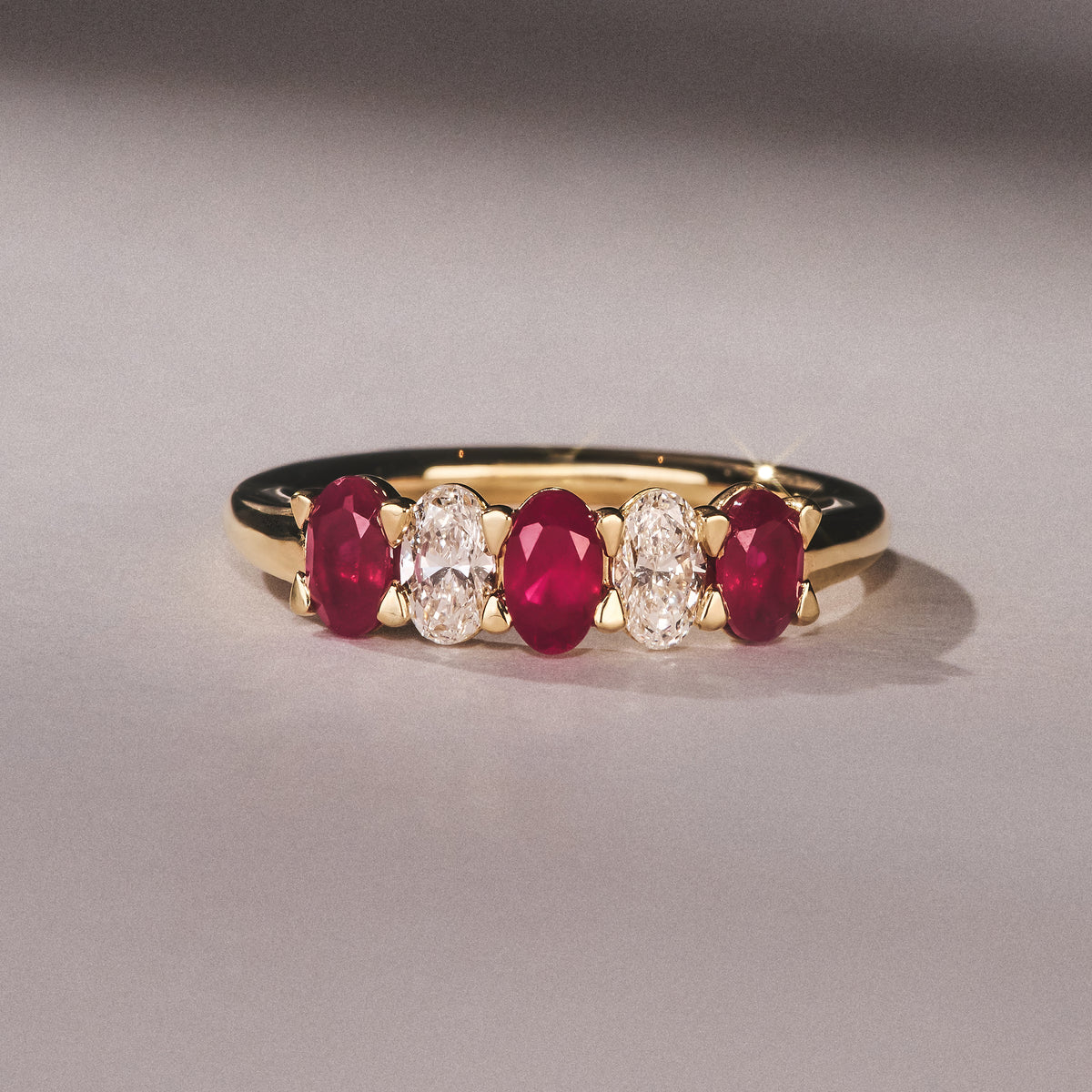 Solene 0.75ct Oval Cut Lab Ruby and Lab Diamond Half Band Eternity Ring in 18K Yellow Gold