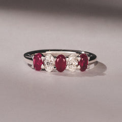 Solene 0.75ct Oval Cut Lab Ruby and Lab Diamond Half Band Eternity Ring in 18K White Gold