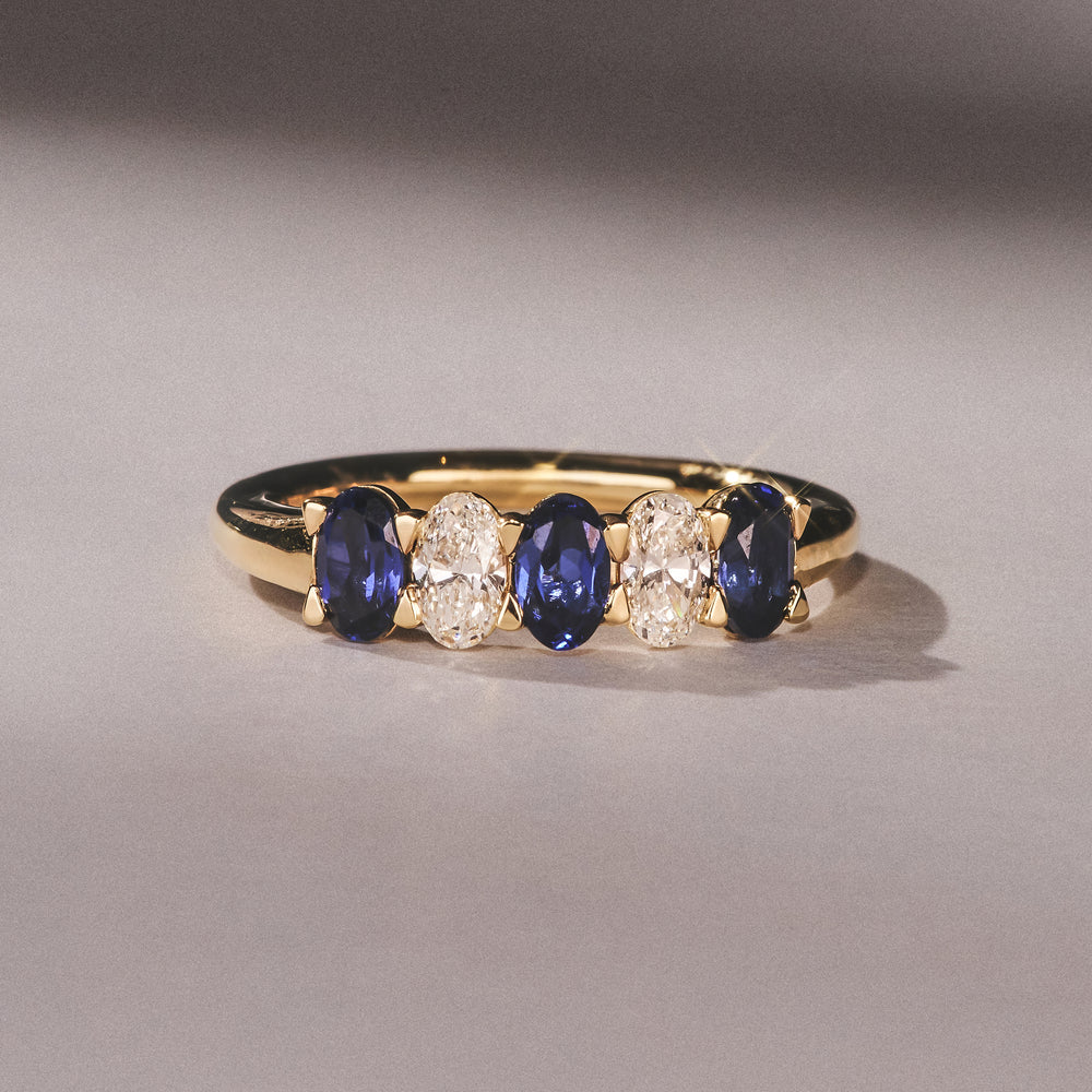 Solene 0.75ct Oval Cut Lab Sapphire and Lab Diamond Half Band Eternity Ring in 18k Yellow Gold