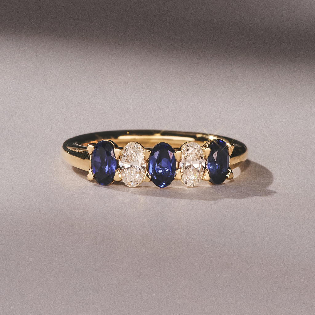 Solene 0.75ct Oval Cut Lab Sapphire and Lab Diamond Half Band Eternity Ring in 18k Yellow Gold