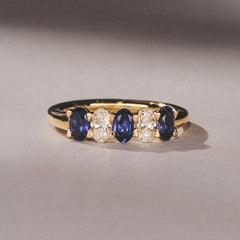 Solene 0.75ct Oval Cut Lab Sapphire and Lab Diamond Half Band Eternity Ring in 18k Yellow Gold