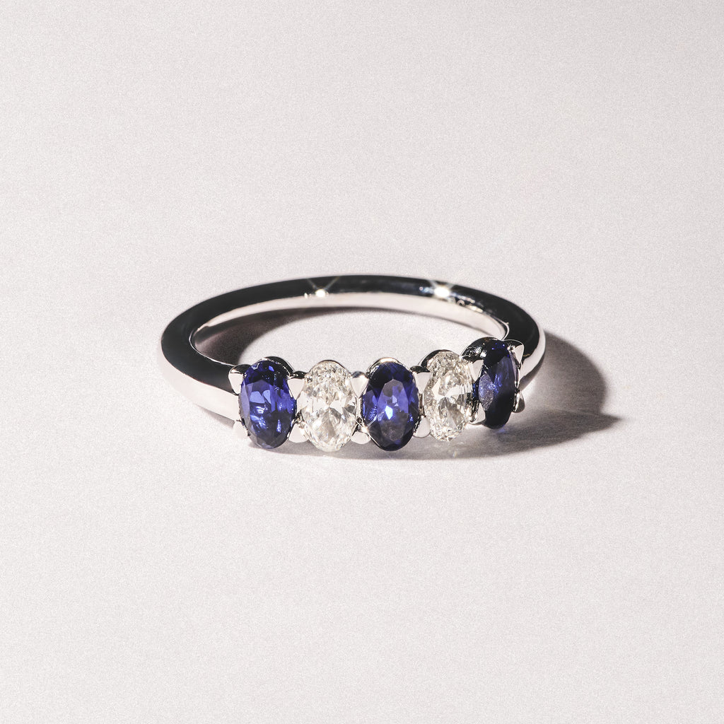 Solene 0.75ct Oval Cut Lab Sapphire and Lab Diamond Half Band Eternity Ring in 18k White Gold