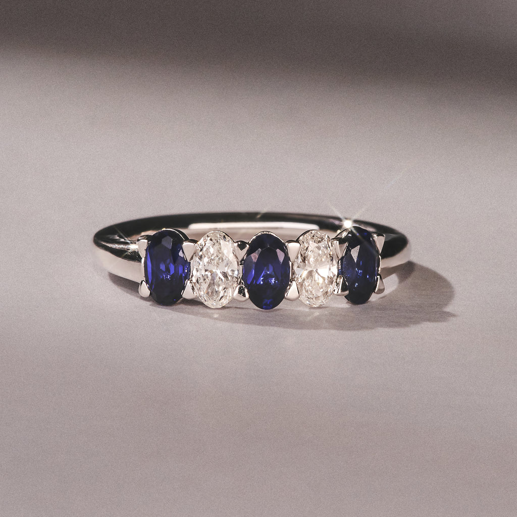 Solene 0.75ct Oval Cut Lab Sapphire and Lab Diamond Half Band Eternity Ring in 18k White Gold