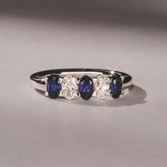 Solene 0.75ct Oval Cut Lab Sapphire and Lab Diamond Half Band Eternity Ring in 18k White Gold