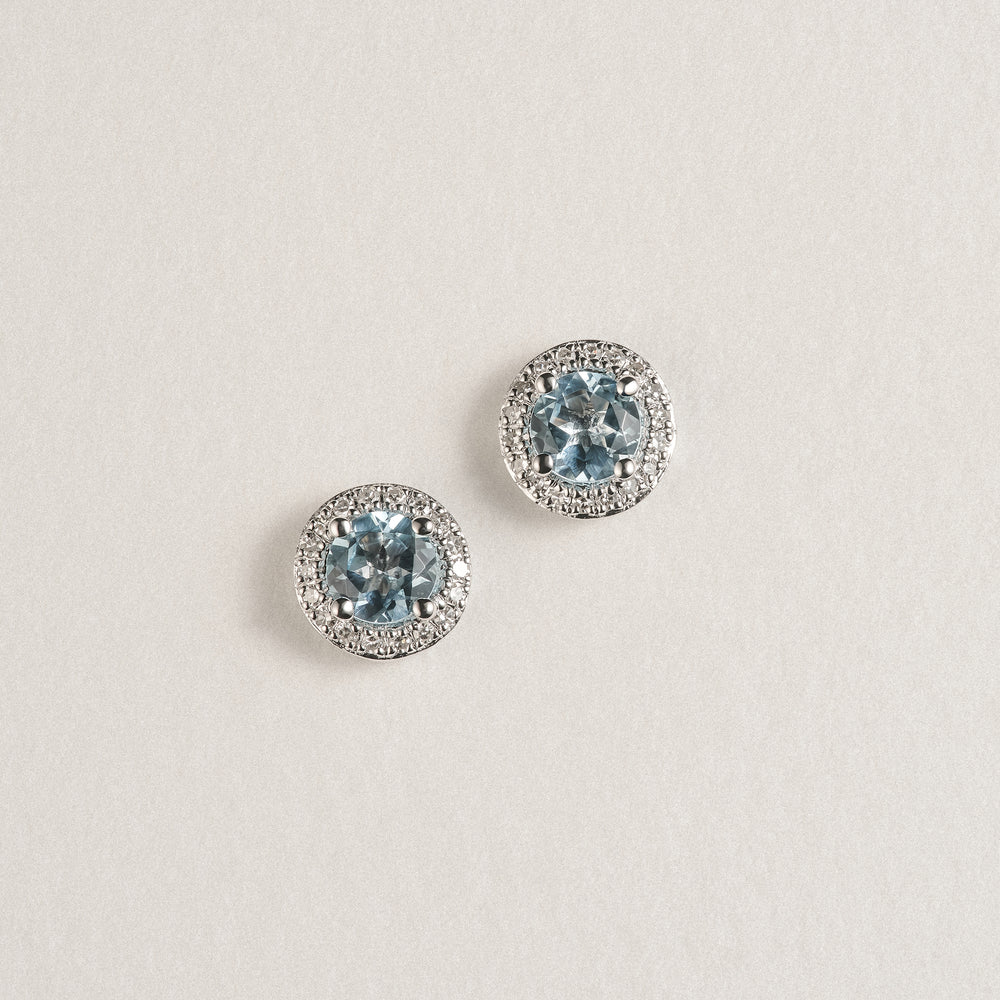 Stellato 0.75ct Round Cut Blue Topaz and Lab Diamond Halo Stud Earrings in Sterling Silver