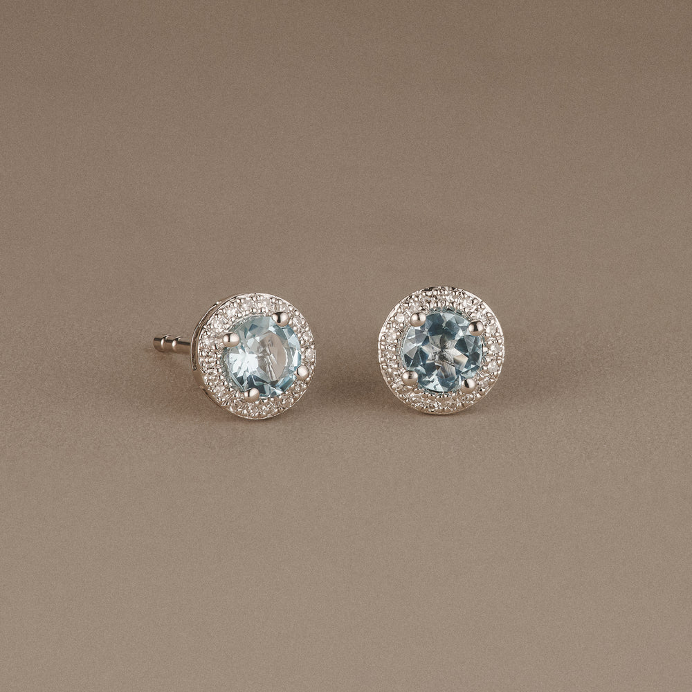 Stellato 0.75ct Round Cut Blue Topaz and Lab Diamond Halo Stud Earrings in Sterling Silver