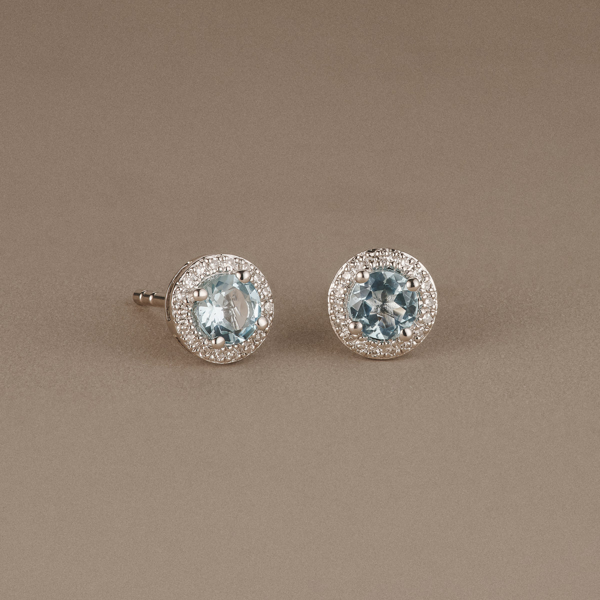 Stellato 0.75ct Round Cut Blue Topaz and Lab Diamond Halo Stud Earrings in Sterling Silver