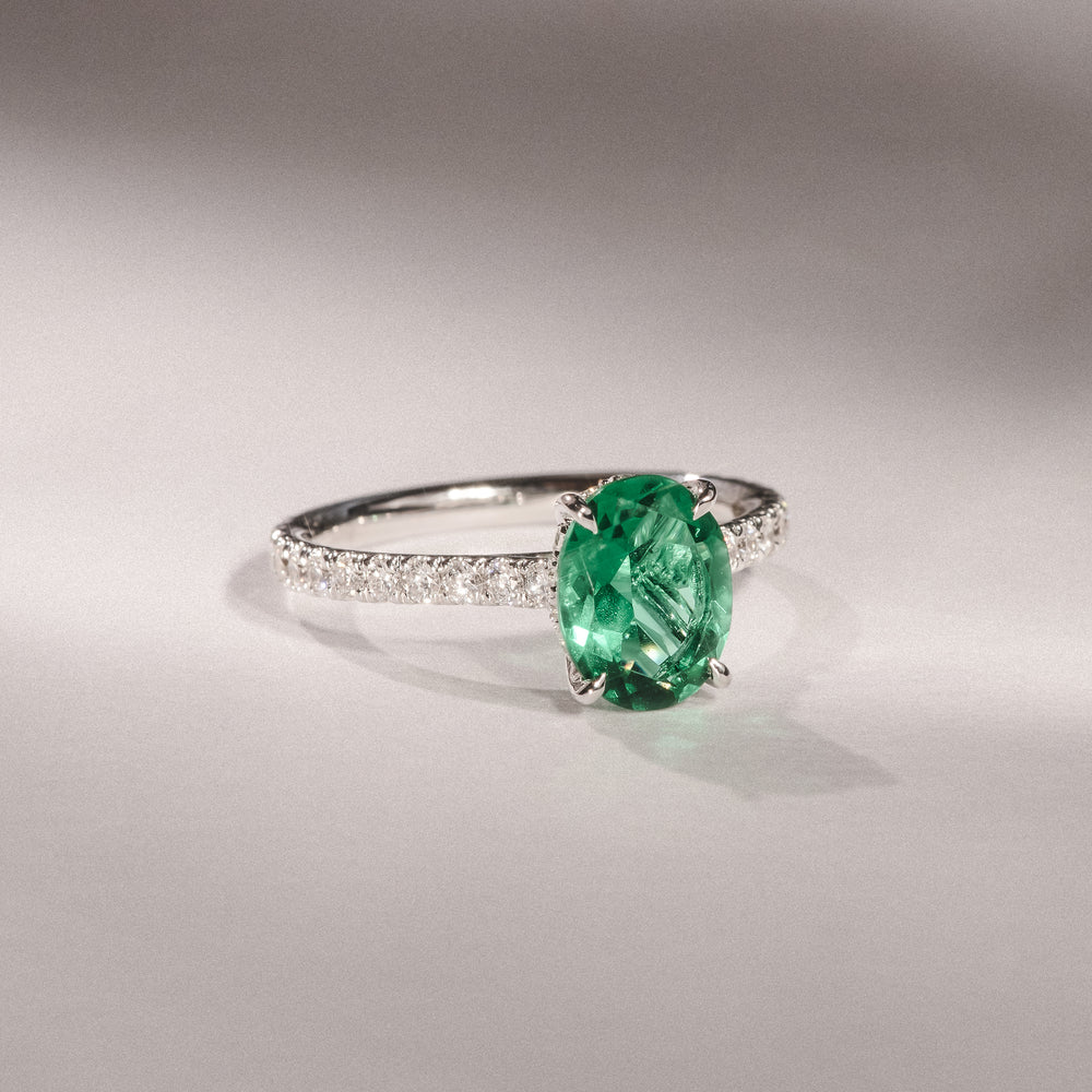 Amora Gem 2.00ct Oval Cut Lab Emerald Hidden Halo Engagement Ring with Side Stones in 18K White Gold