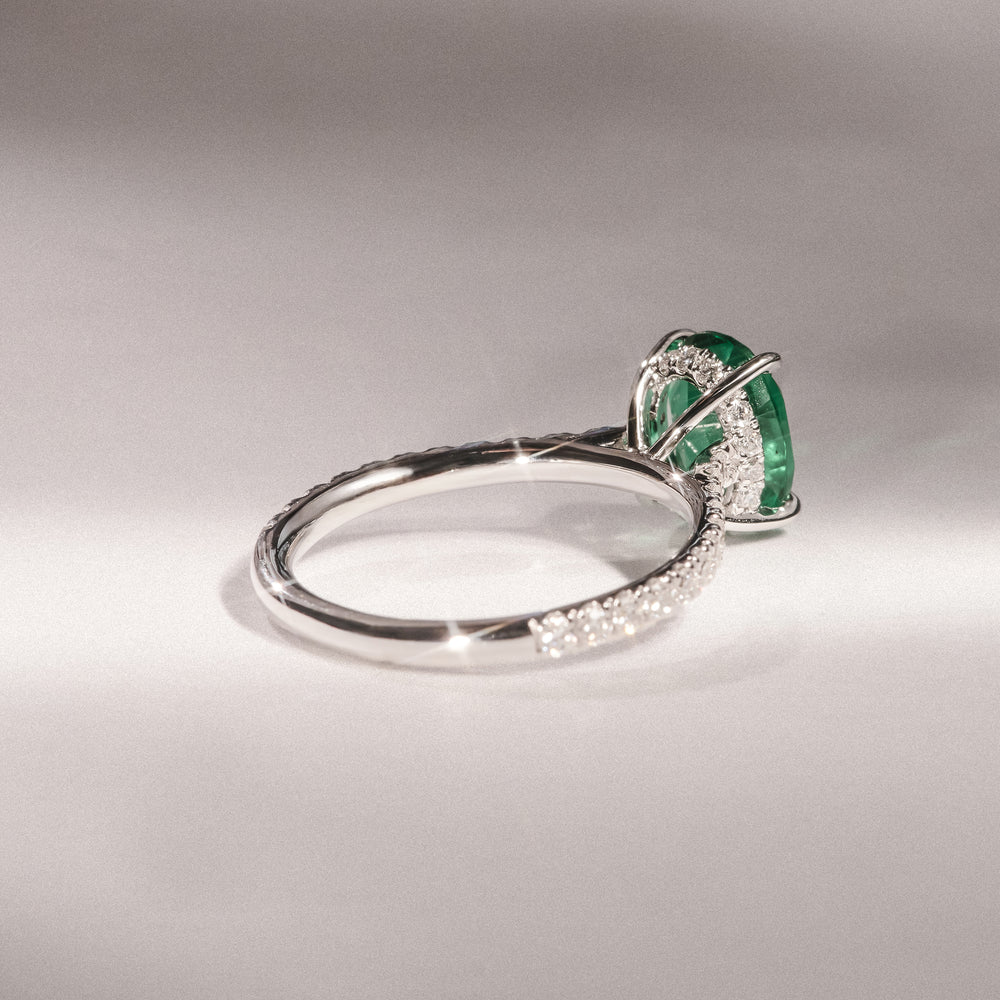 Amora Gem 2.00ct Oval Cut Lab Emerald Hidden Halo Engagement Ring with Side Stones in 18K White Gold