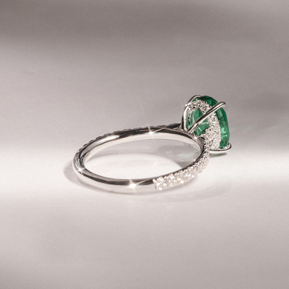 Amora Gem 2.00ct Oval Cut Lab Emerald Hidden Halo Engagement Ring with Side Stones in 18K White Gold