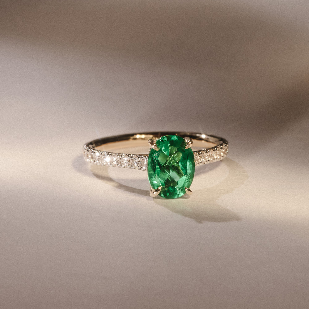 Amora Gem 2.00ct Oval Cut Lab Emerald Hidden Halo Engagement Ring with Side Stones in 18K Yellow Gold