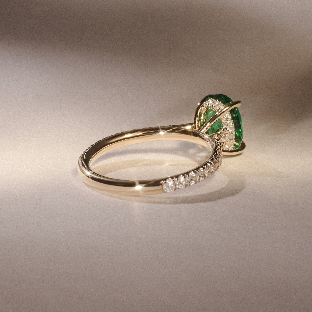 Amora Gem 2.00ct Oval Cut Lab Emerald Hidden Halo Engagement Ring with Side Stones in 18K Yellow Gold