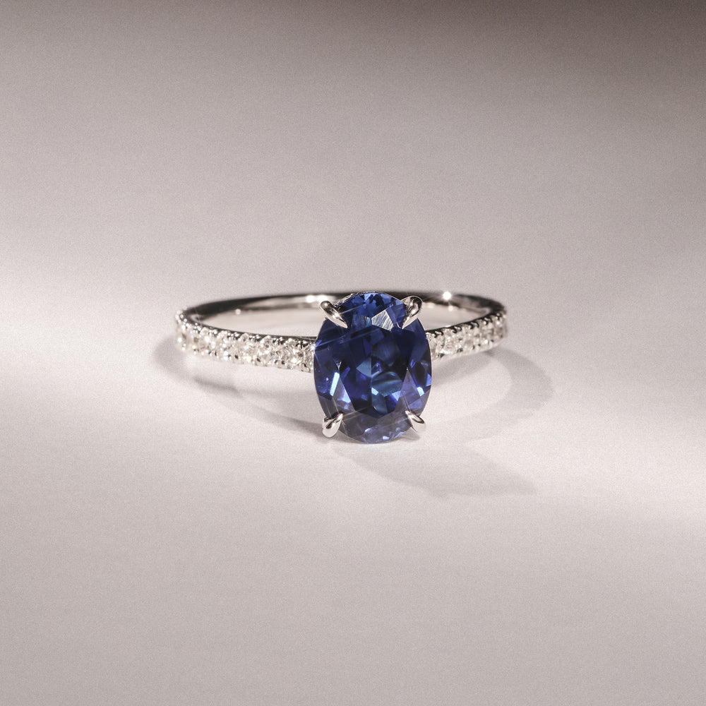 Amora Gem 2.00ct Oval Cut Lab Sapphire Hidden Halo Engagement Ring with Side Stones in 18K White Gold