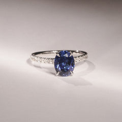 Amora Gem 2.00ct Oval Cut Lab Sapphire Hidden Halo Engagement Ring with Side Stones in 18K White Gold
