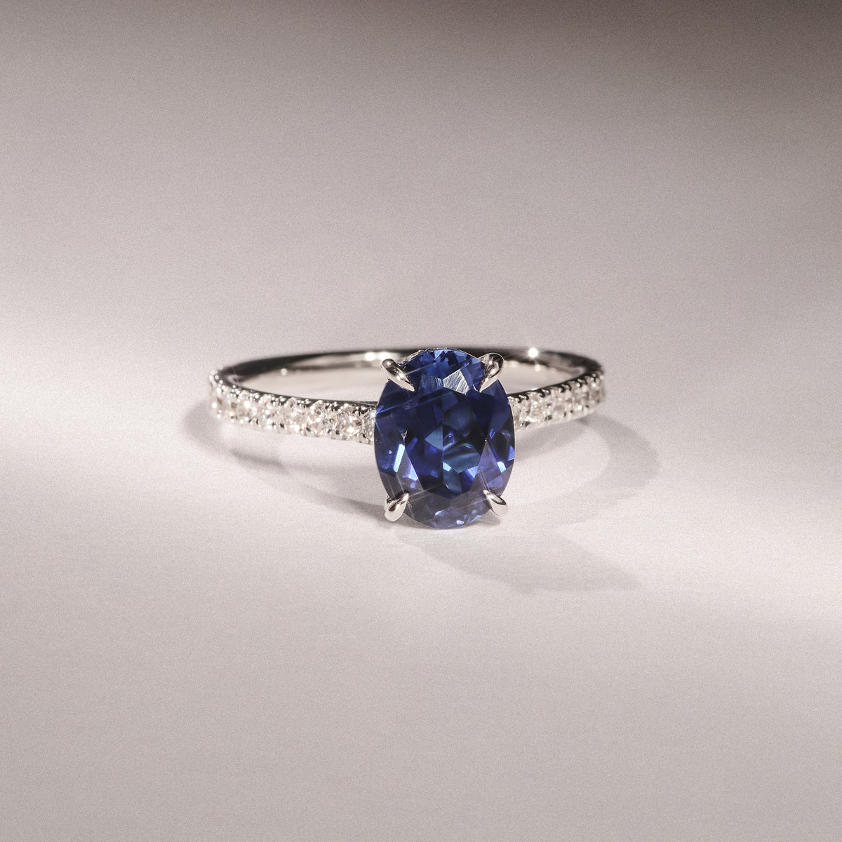Amora Gem 2.00ct Oval Cut Lab Sapphire Hidden Halo Engagement Ring with Side Stones in 18K White Gold