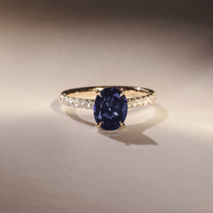 Amora Gem 2.00ct Oval Cut Lab Sapphire Hidden Halo Engagement Ring with Side Stones in 18K Yellow Gold