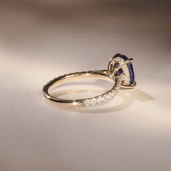 Amora Gem 2.00ct Oval Cut Lab Sapphire Hidden Halo Engagement Ring with Side Stones in 18K Yellow Gold