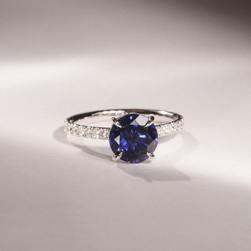 Amora Gem 2.00ct Round Cut Lab Sapphire Hidden Halo Engagement Ring with Side Stones in 18K White Gold