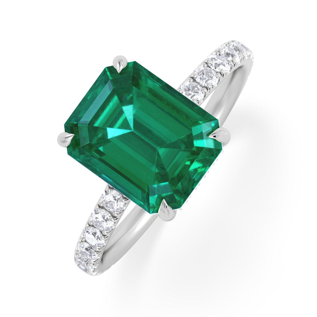 Amora Gem 2.50ct Emerald Cut Lab Emerald Hidden Halo Engagement Ring with Side Stones in 18K White Gold