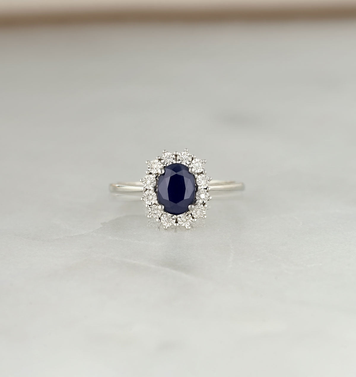 Sapphire Ring With Diamond Halo 7 x 5mm Set in 9K White Gold