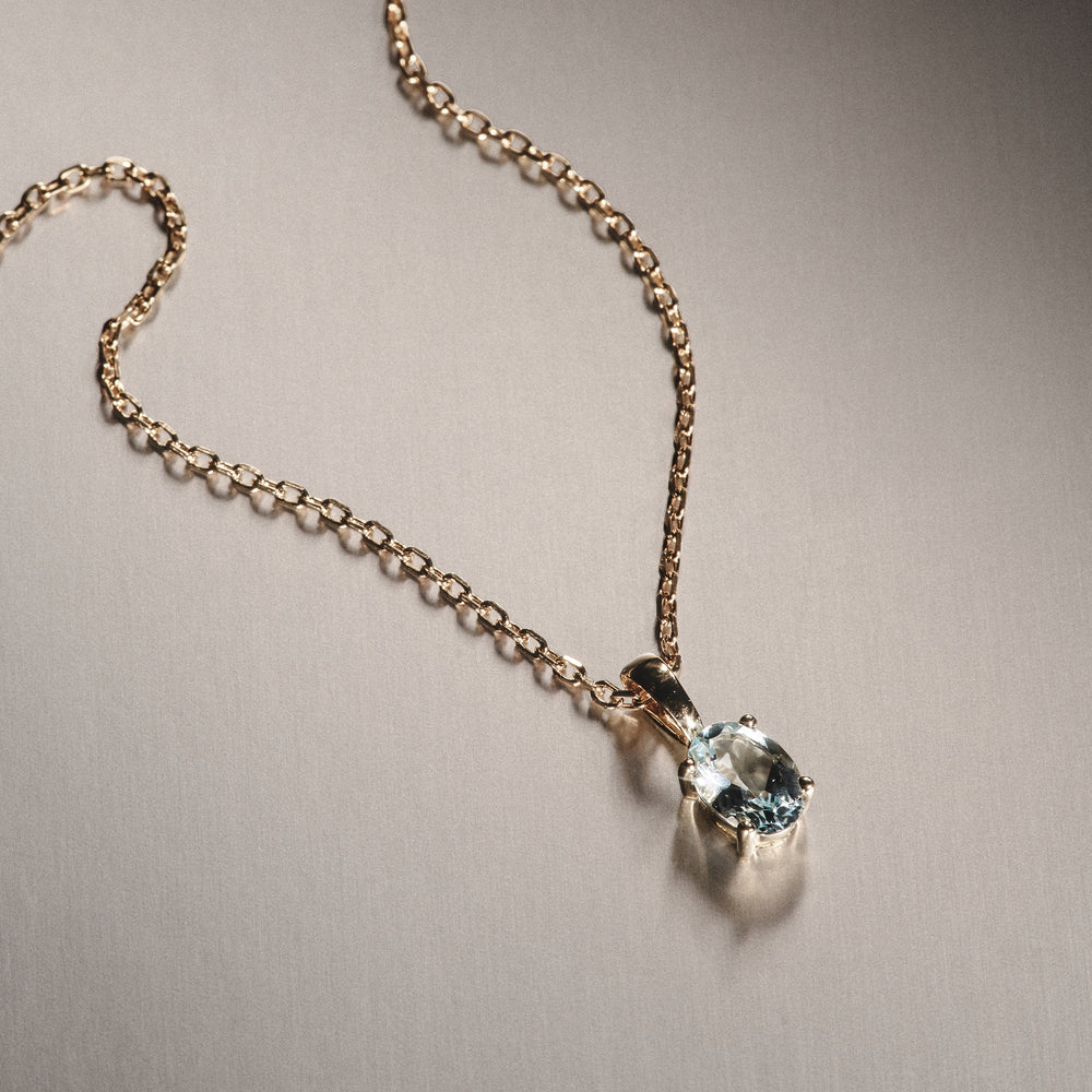 Blue Topaz 7 x 5mm 9K Yellow Gold Pendant Necklace