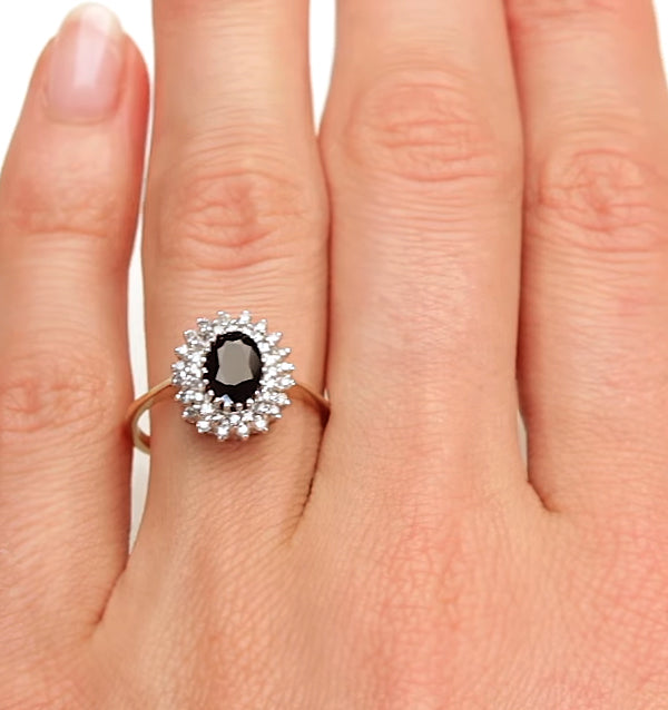 Sapphire 7 x 5mm And Diamond 9K Gold Ring