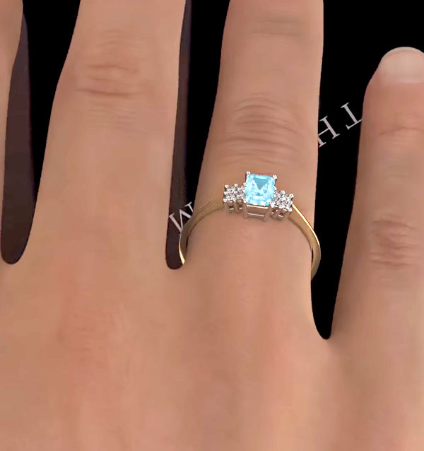Blue Topaz 6 x 4mm And Diamond Ring 9K Yellow Gold