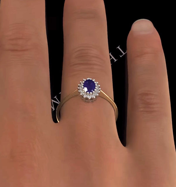 Tanzanite 6 x 4mm And Diamond 9K Gold Ring