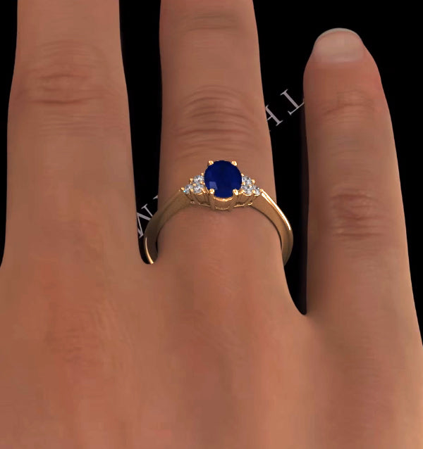 Sapphire 7 x 5mm And Diamond 18K Gold Ring
