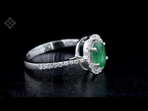 Emerald 0.70ct And Diamond 18K White Gold Ring